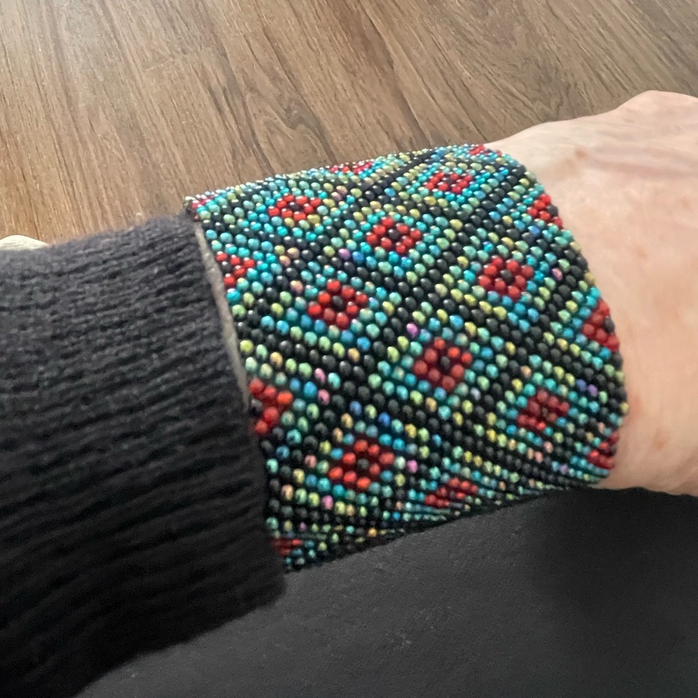 Bracelet: Woven pattern of 1mm shiny thin multi color beads. 6"x2" smoke free.